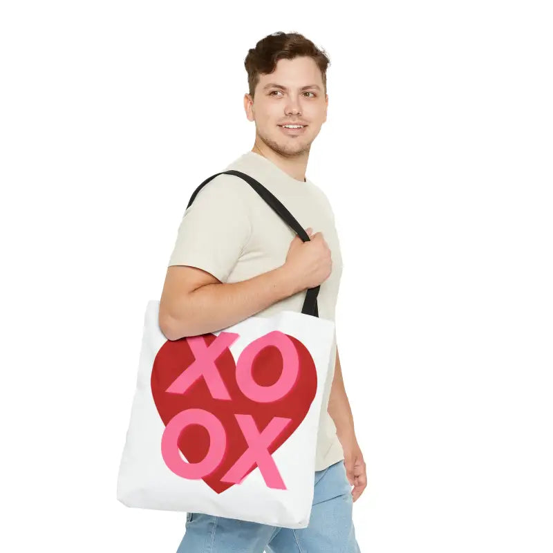 White tote bag with pink and red ’XOXO’ design.