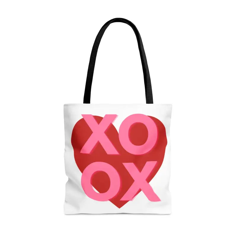 White tote bag with ’XOXO’ text in pink and red forming a heart shape.