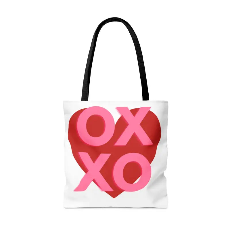 White tote bag with ’XOXO’ text inside a red heart design.