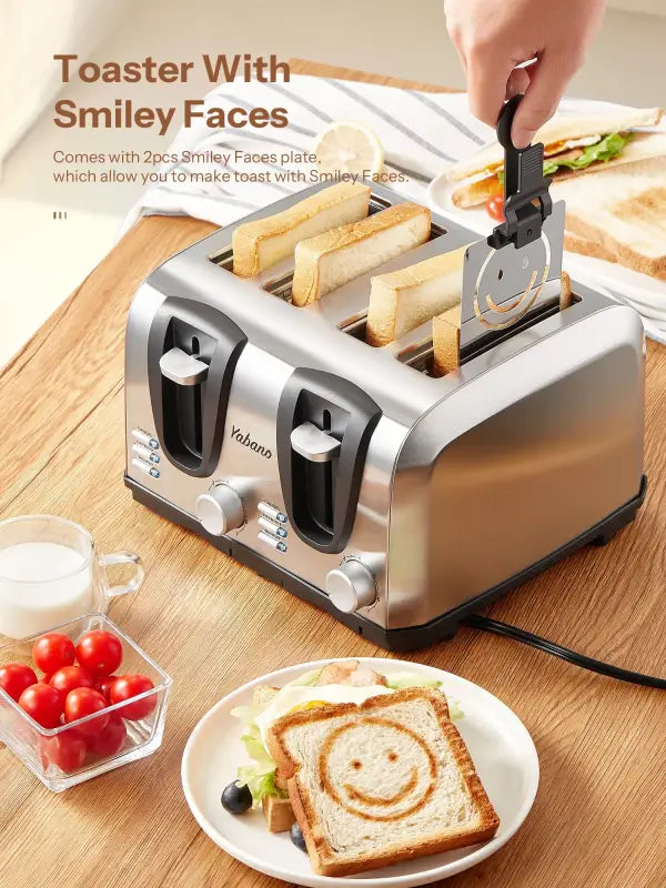 Silver four-slice toaster with smiley face attachment.