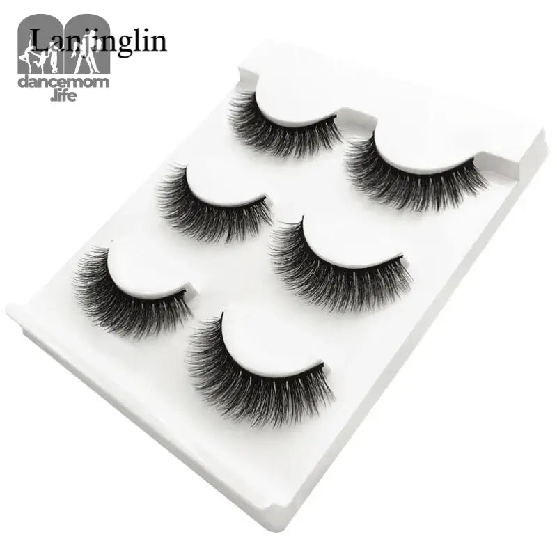 False eyelashes on a white tray.