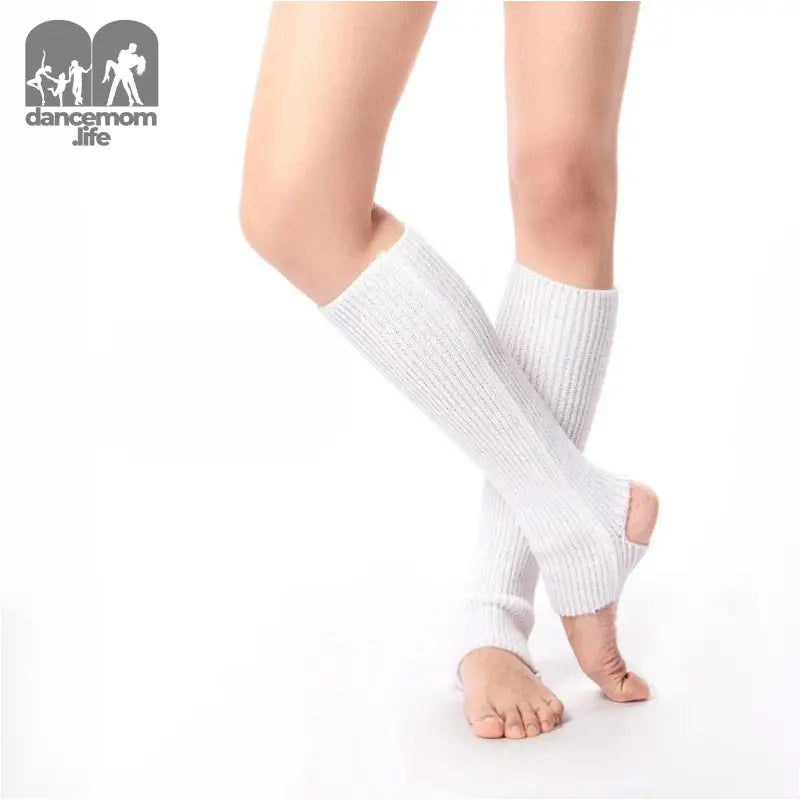 White knit leg warmers worn over bare feet.