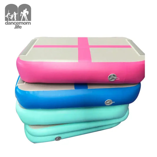 Stacked inflatable gymnastics mats.