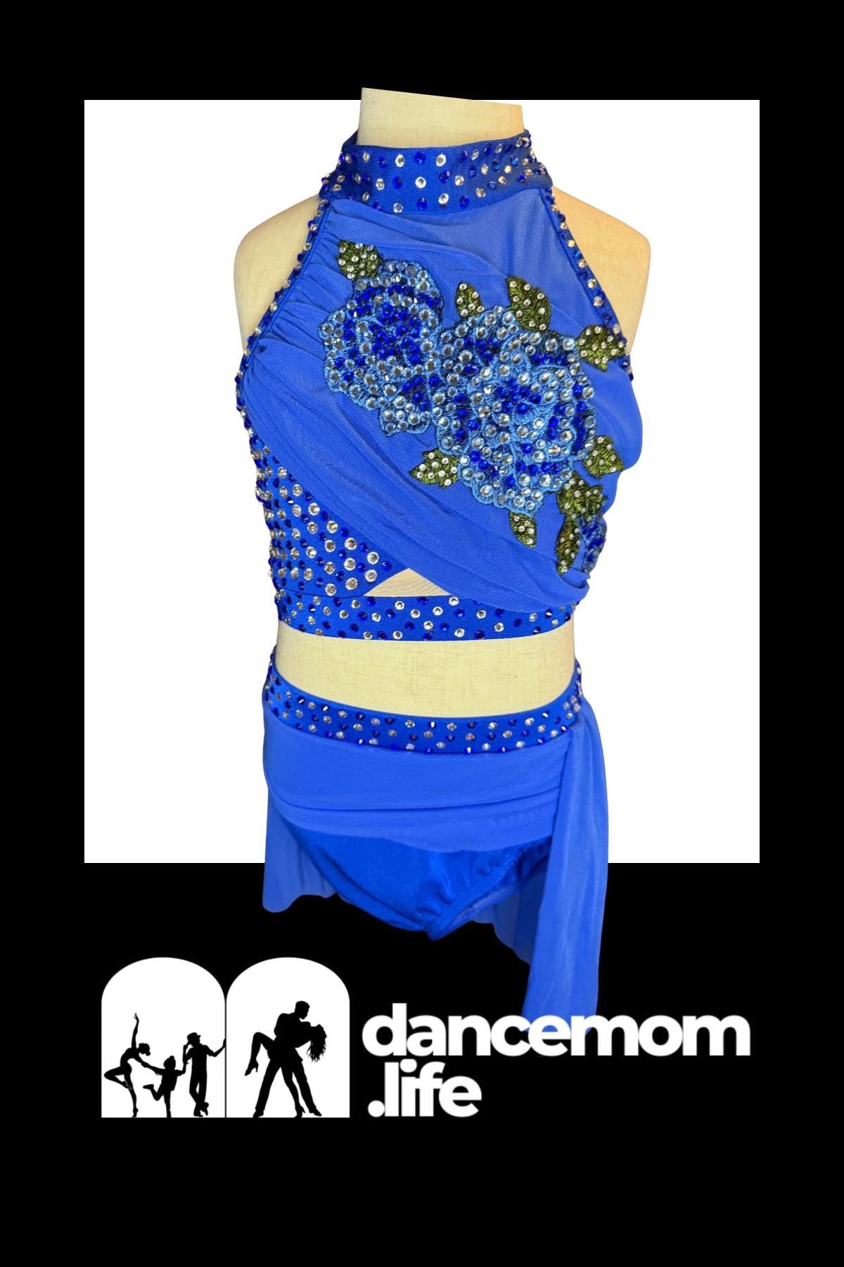 Blue sequined dance leotard with floral embellishments and a matching skirt.