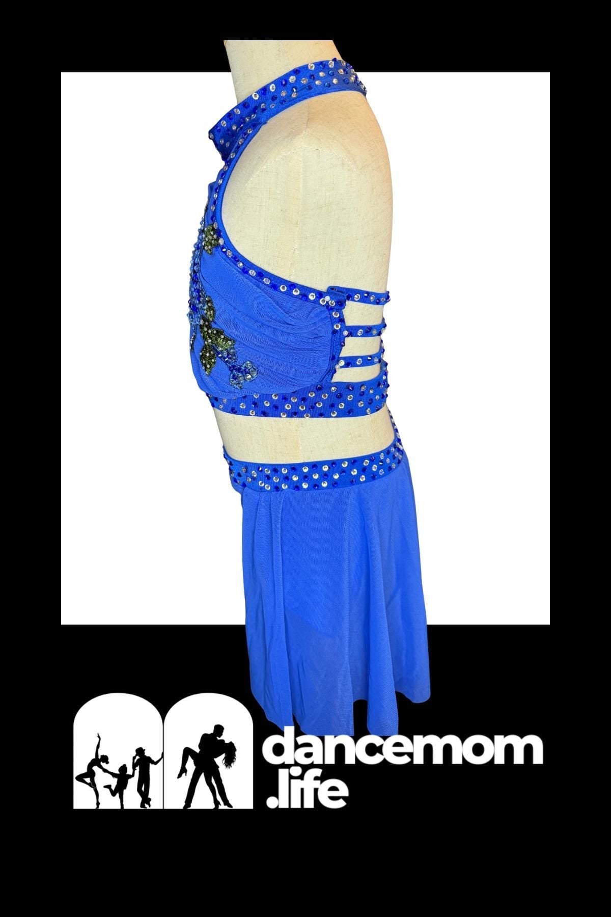 Vibrant royal blue dance leotard with sequined embellishments and a matching skirt.
