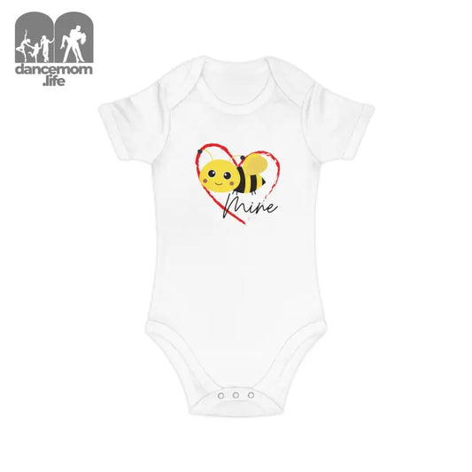 White baby onesie with a cute cartoon bee and heart design.