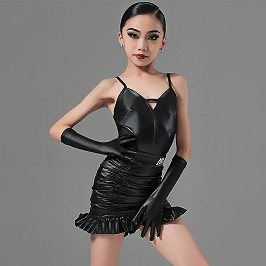 Black leather mini dress with ruched details, ruffled hem and matching long gloves.