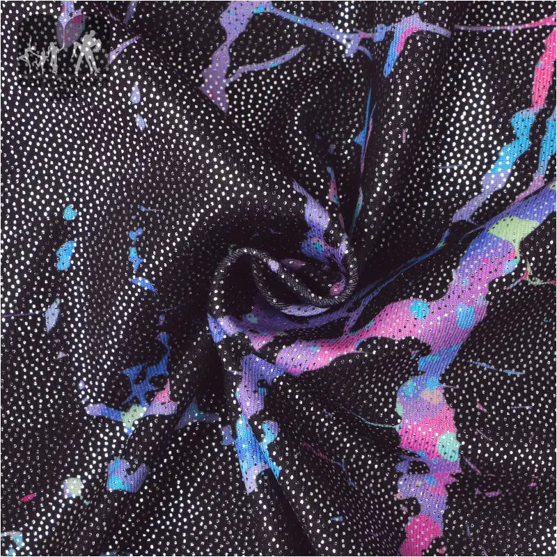 Swirling abstract pattern with black background featuring purple, pink, and blue paint splatters dotted with white specks.