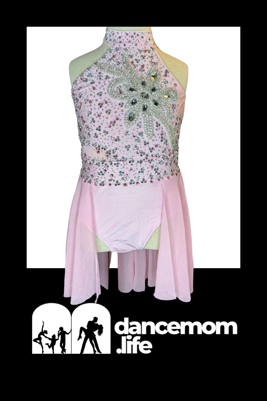 A delicate pink dance leotard with a high neckline, adorned with sparkling silver and multicolored rhinestones forming an intricate floral design across the bodice.