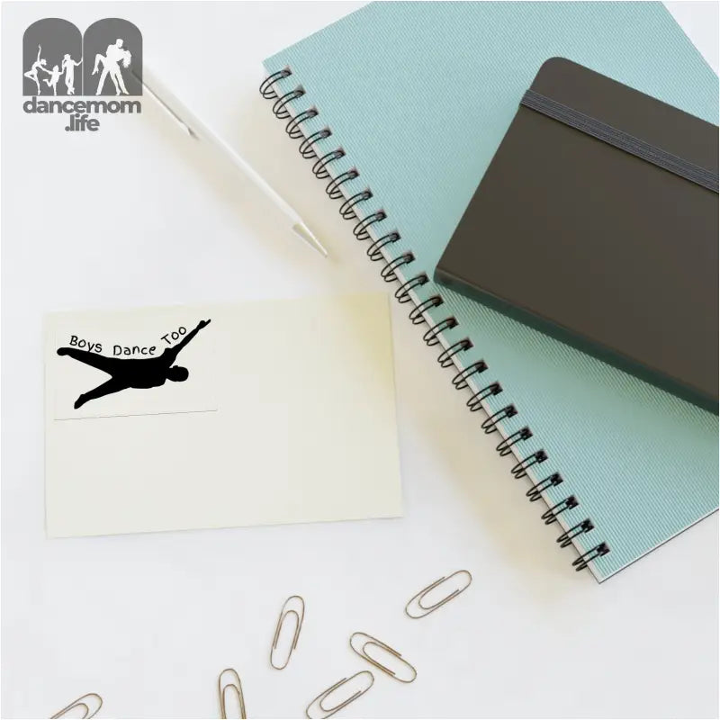 Black airplane silhouette on a white note card with ’bon voyage’ text.