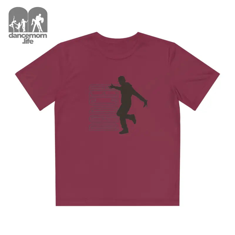 Burgundy t-shirt with a black silhouette of a person kicking printed on it.