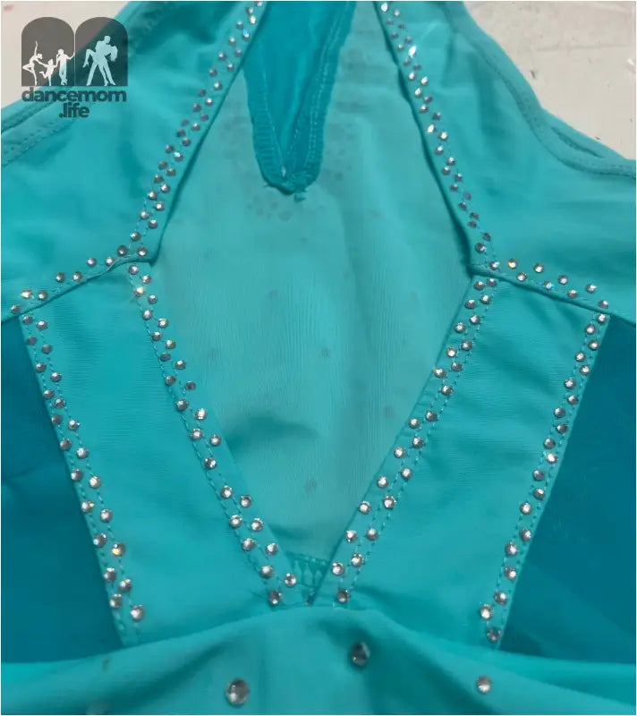 Turquoise halter-style top adorned with rhinestone embellishments.