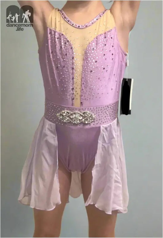 Pink and beige figure skating dress with sequins and a sheer skirt.