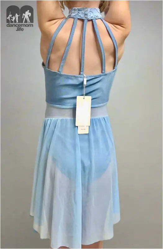 Light blue dress with a strappy open back design and a price tag attached.