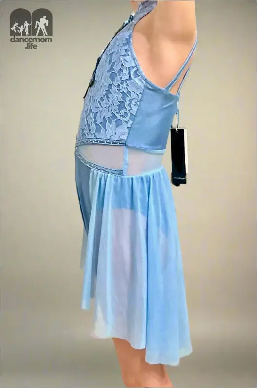 Light blue dance dress with lace bodice and flowing skirt.