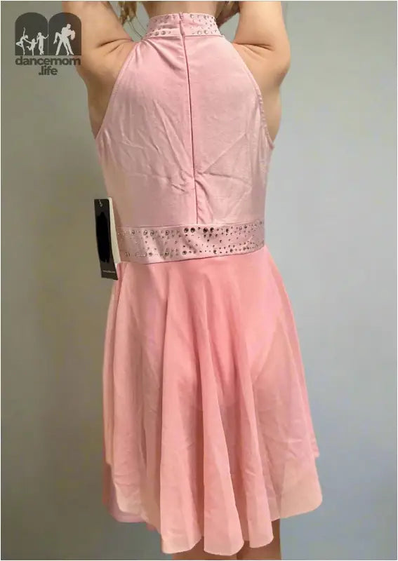 Pink sleeveless dress with a lace waistband and flared skirt.