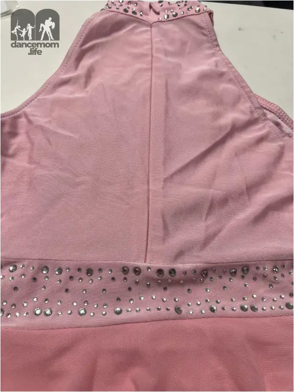 Pink halter-style top with rhinestone embellishments along the neckline and waistband.