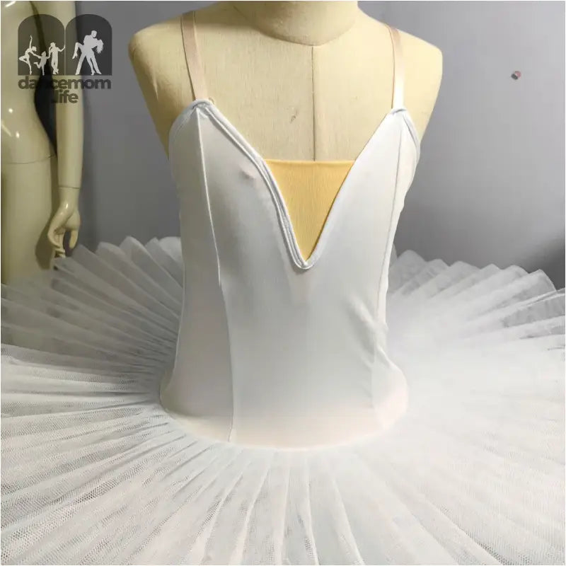 White classical ballet tutu with a plunging neckline bodice.