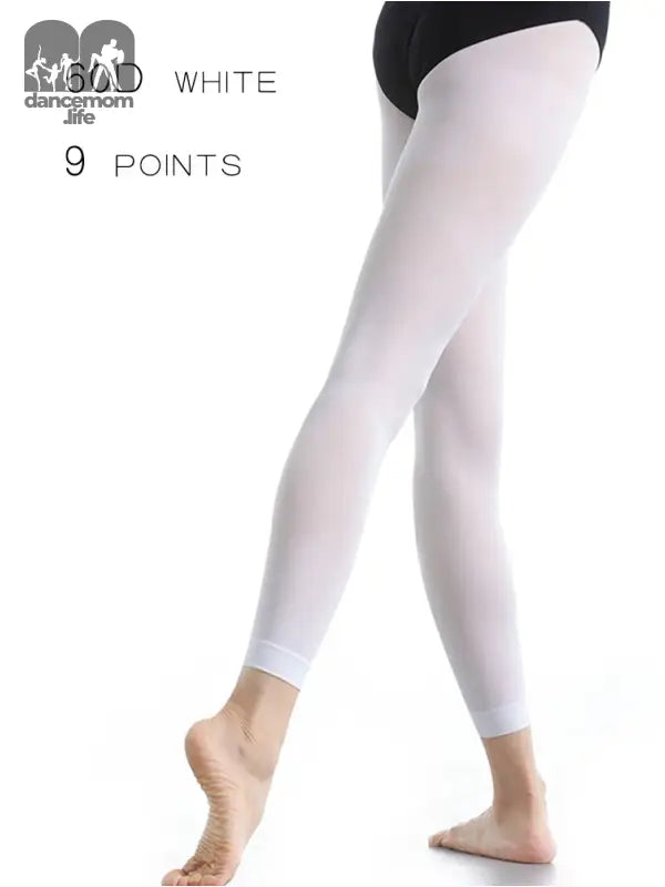 White footless dance tights or leggings worn on a leg.