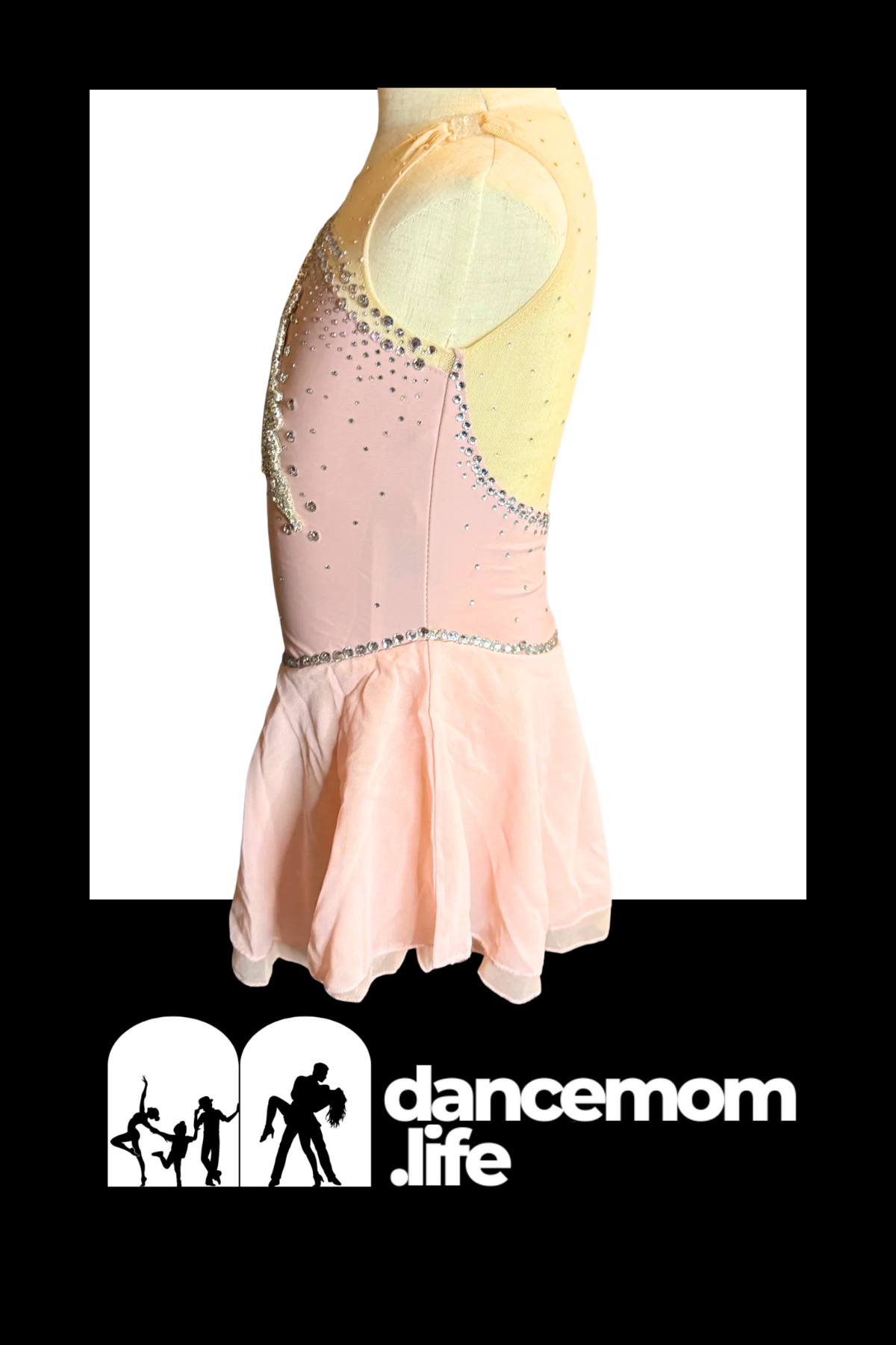 A soft pink and pale yellow dance dress with a fitted bodice adorned in sparkling rhinestones along the side seams, featuring a flowing skirt made of sheer tulle.