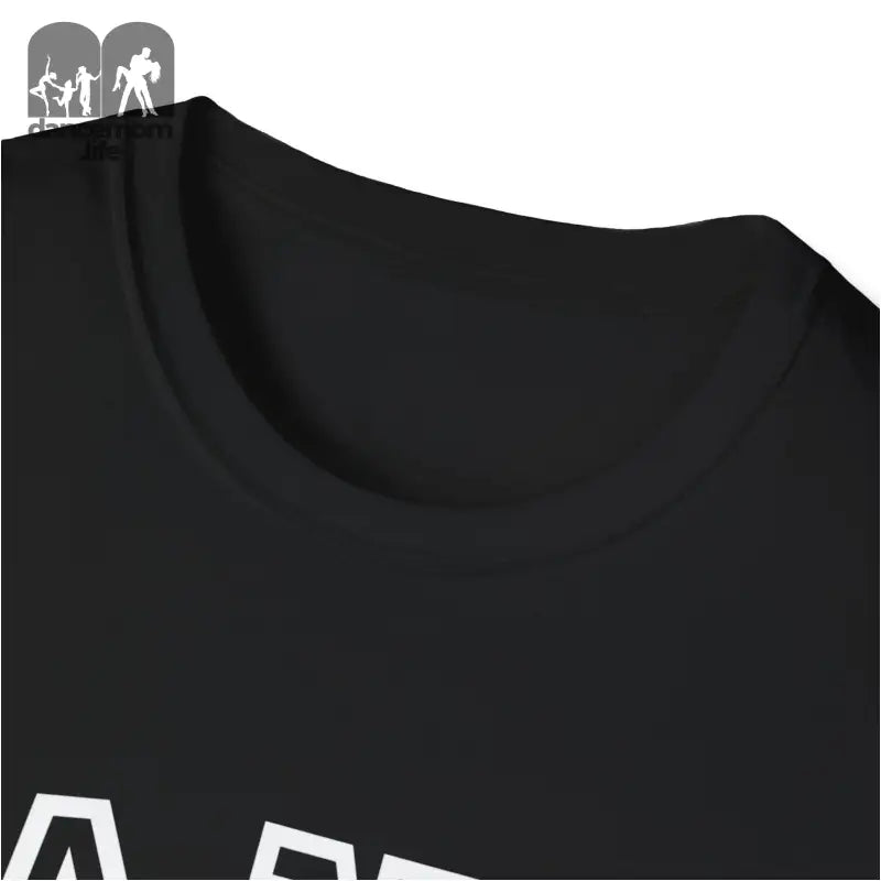 Black t-shirt with white text visible at the bottom edge.