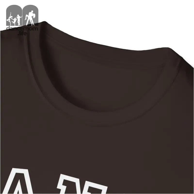 Dark brown t-shirt with white text visible at the bottom edge.