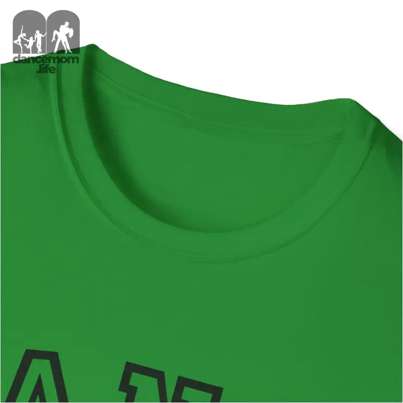 Green t-shirt with a partial black graphic visible.