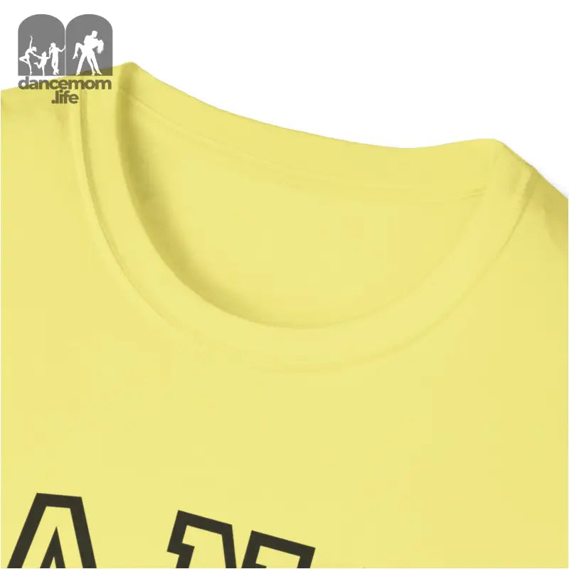 Yellow t-shirt with partial black text visible.