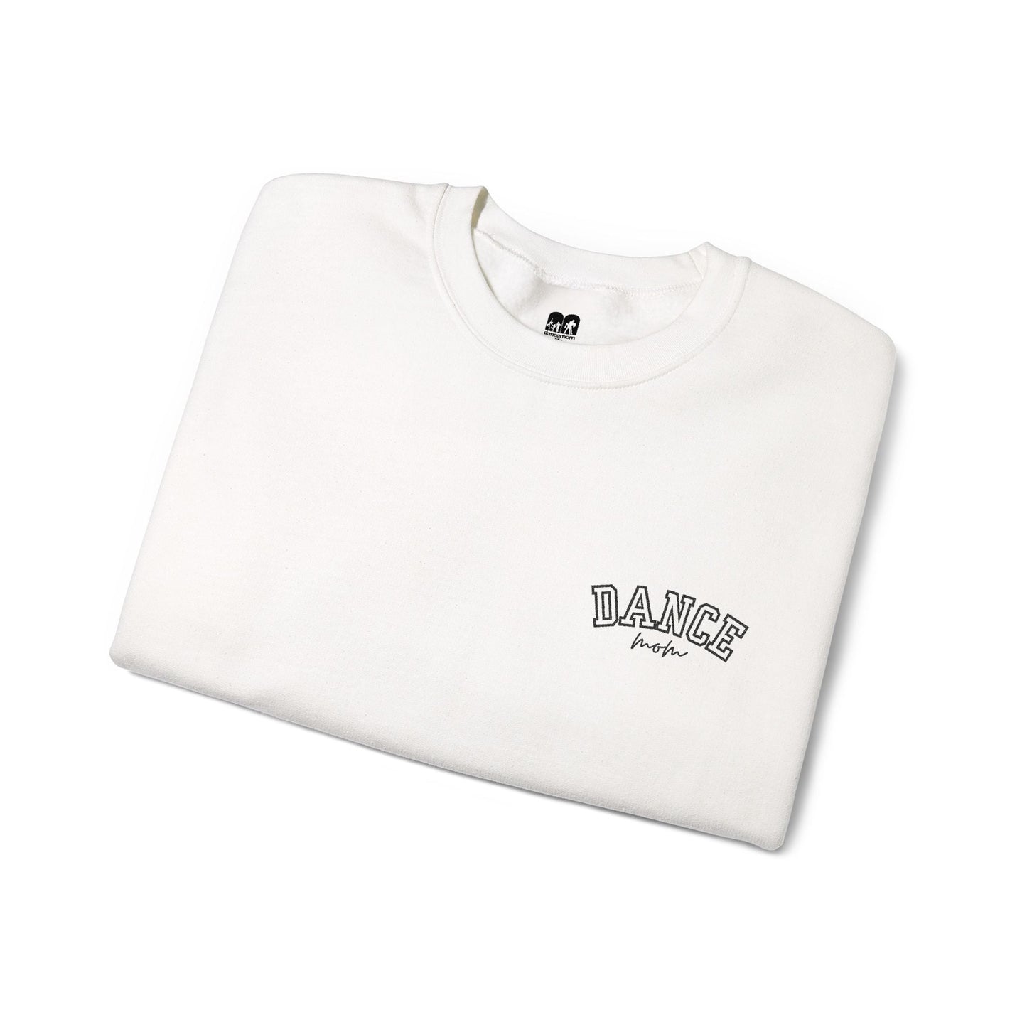A white crewneck sweatshirt with ’dance’ embroidered in black arched lettering above the word ’mom’ in a cursive script.
