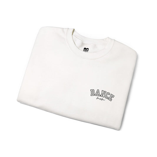 A white crewneck sweatshirt with ’dance’ embroidered in black arched lettering above the word ’mom’ in a cursive script.