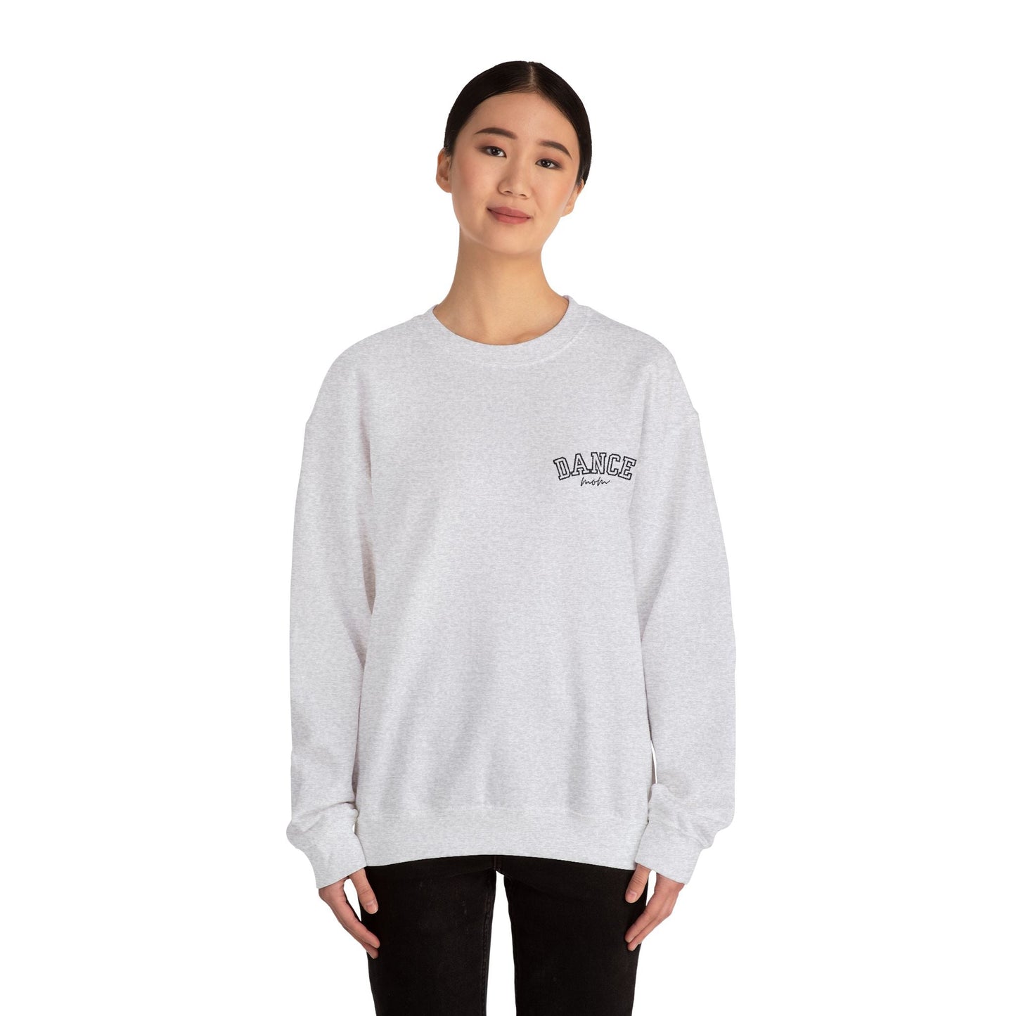 A soft white heathered sweatshirt with a small embroidered ’dance’ logo on the left chest.