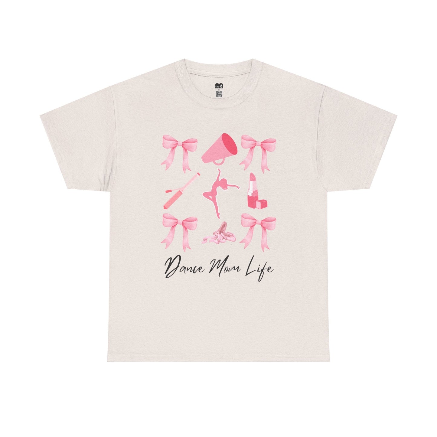 A cream-colored cotton t-shirt featuring a pink graphic of bows, a megaphone, ballet shoes, and lipstick with the text ’dance mom life’ printed below.