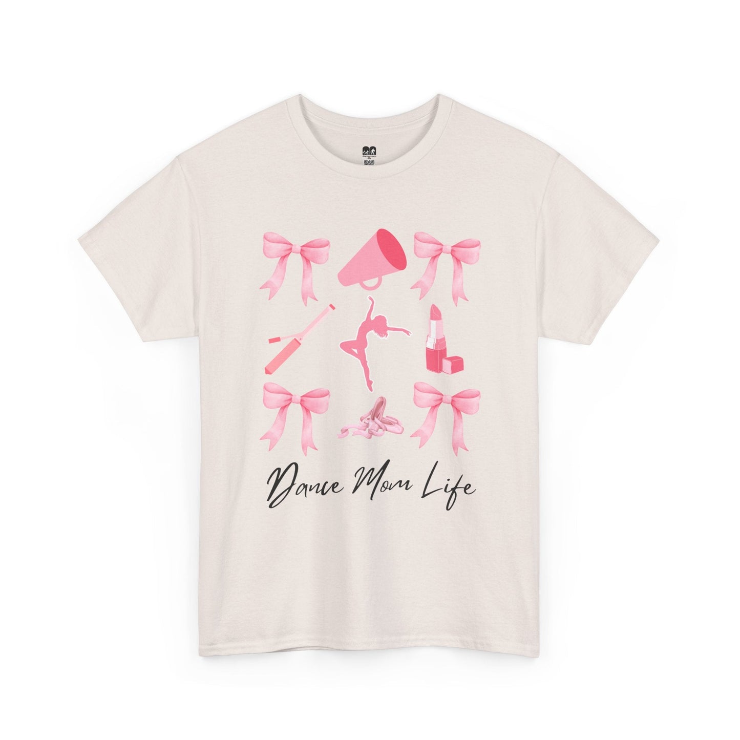 Cream-colored cotton t-shirt featuring a pink graphic of bows, a megaphone, ballet shoes, and lipstick with the text ’dance mom life’ in black cursive script.