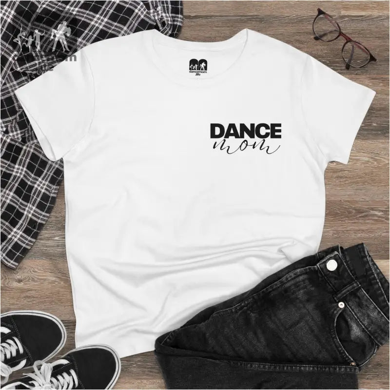 White t-shirt with ’DANCE’ text printed on the front.