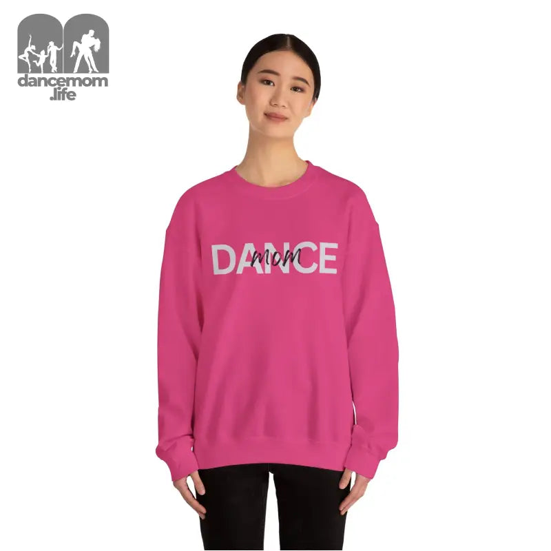 Hot pink crewneck sweatshirt with ’DANCE’ text printed on the front.