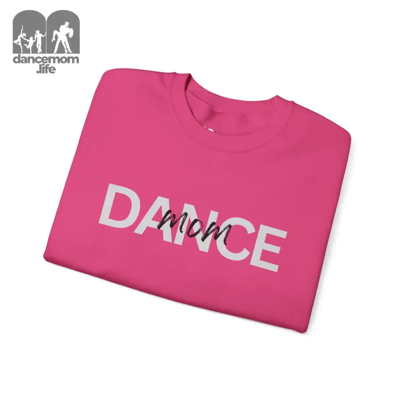 Pink sweatshirt with ’DANCE MOM’ text printed in white letters.