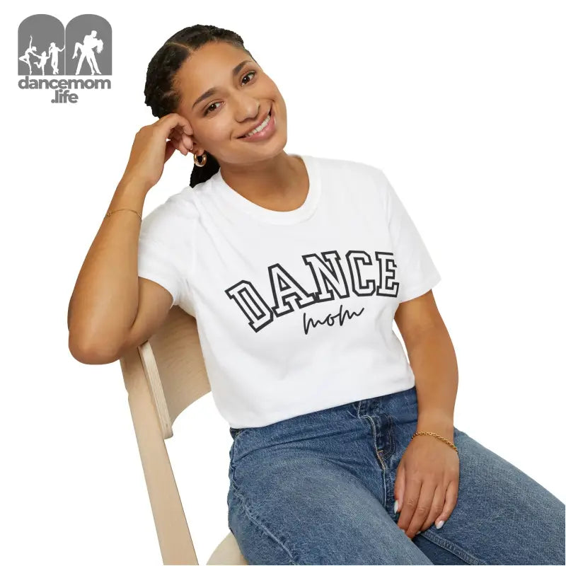 White t-shirt with ’DANCE’ text printed in outlined letters.