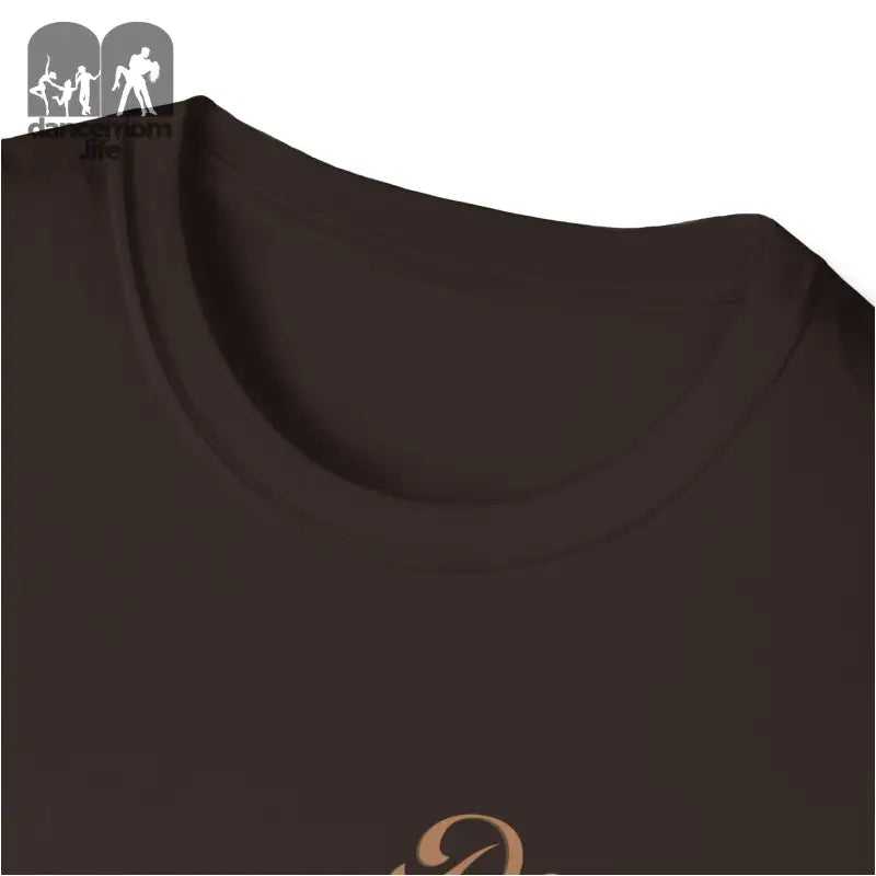 Close-up view of a dark brown t-shirt collar with part of a gold logo visible.