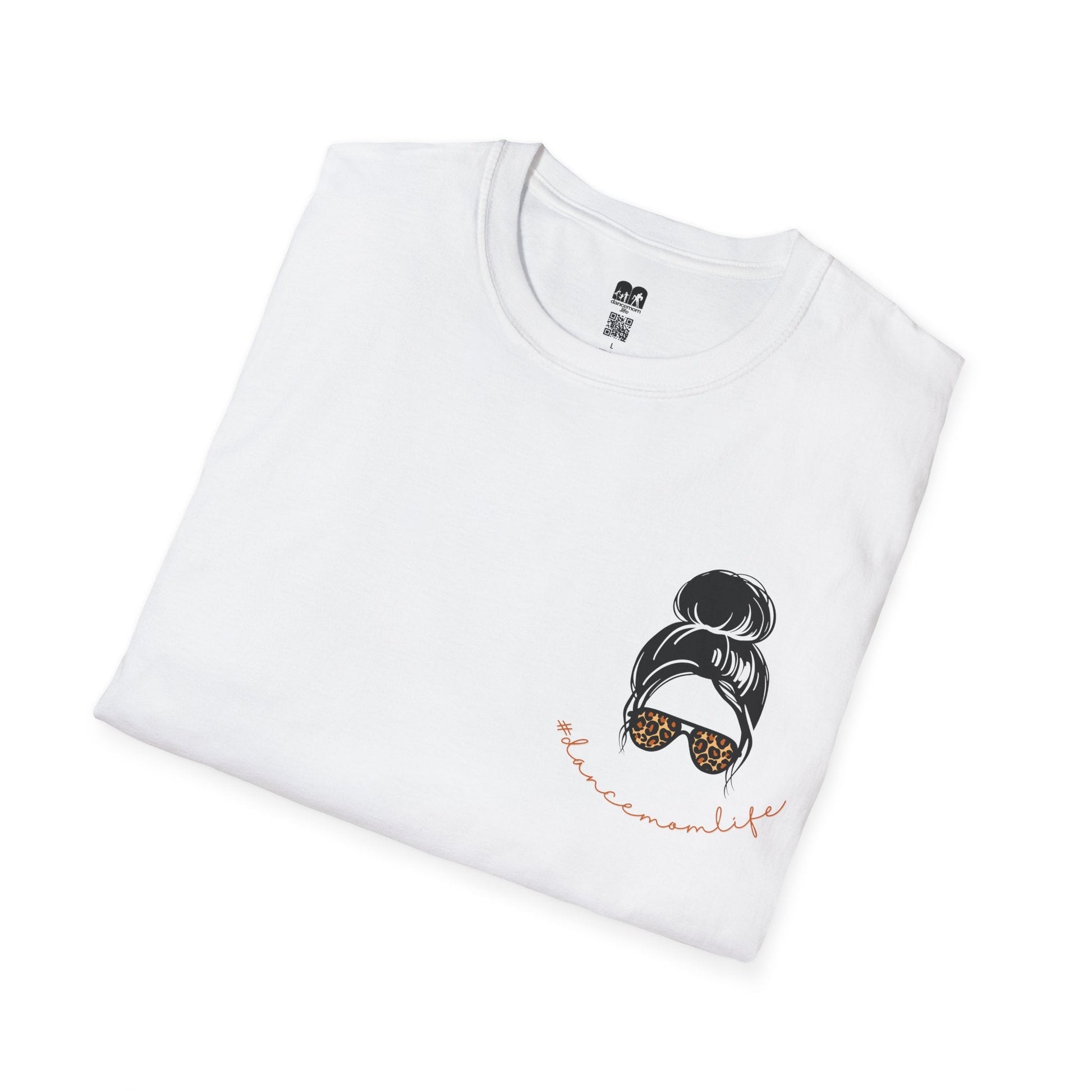 White cotton t-shirt featuring a black illustrated bun with leopard-print sunglasses and the hashtag ’#balancemomlife’ in coral script.