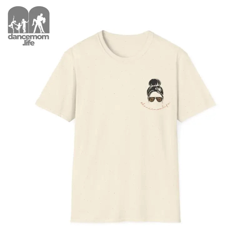 Cream-colored t-shirt with a small cartoon face illustration in the pocket area.