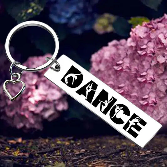 Dance-themed keychain with heart charm.