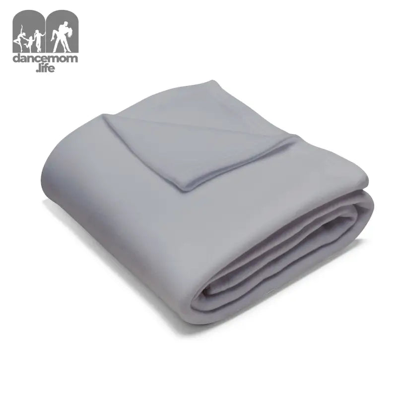 Folded gray fleece blanket with neat edges.