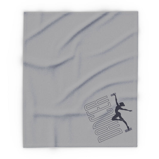 Gray throw blanket featuring a black silhouette of a dancer in mid-leap with the word ’dancer’ printed diagonally beside it.