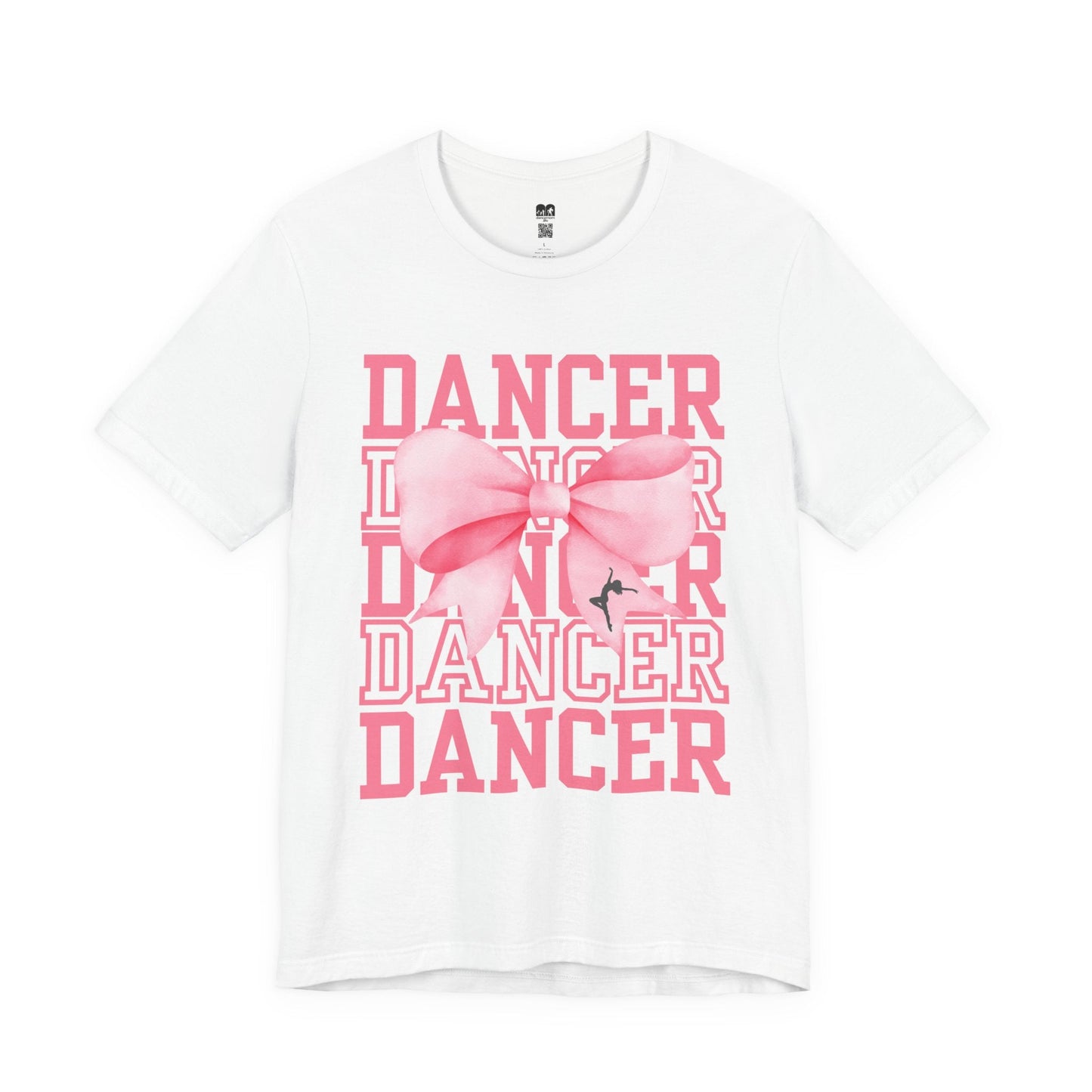 White cotton t-shirt featuring a bold pink ’dancer’ graphic with layered text and a large, stylized bow centered over the words.