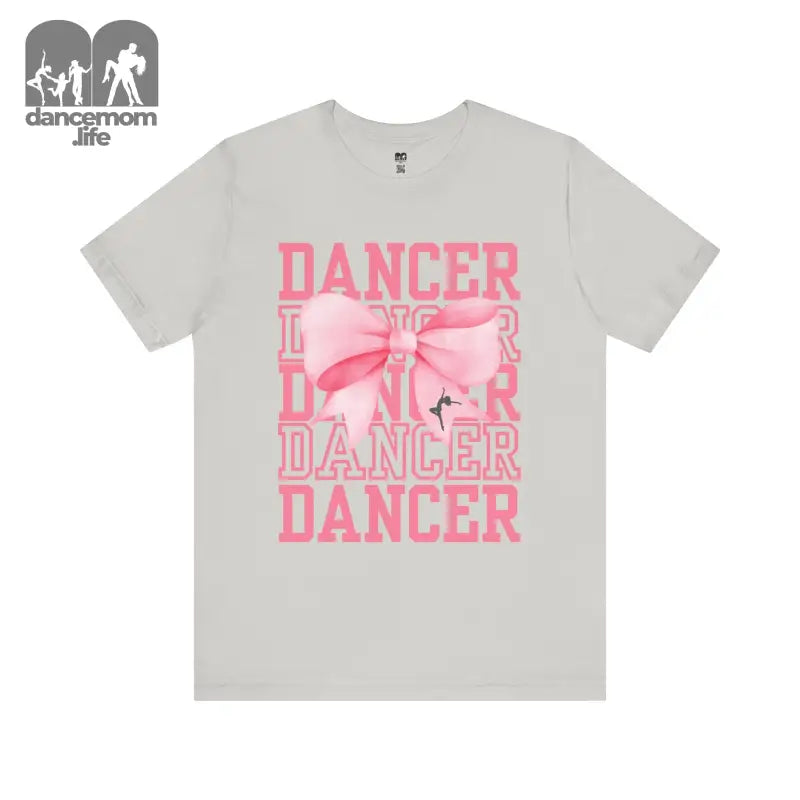 Light gray t-shirt with pink ’DANCER’ text and bow design printed on the front.