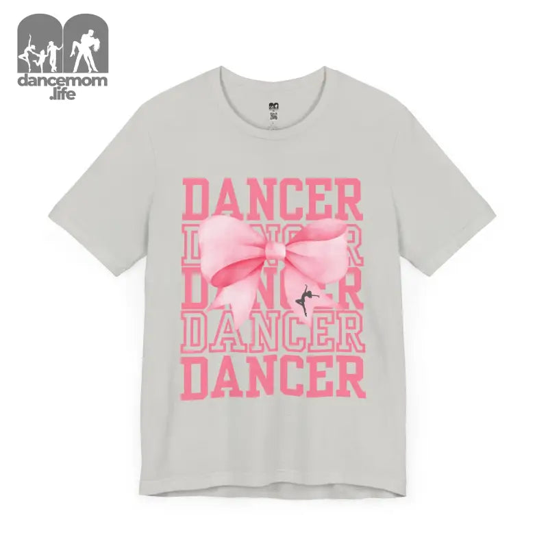 Light gray t-shirt with pink ’DANCER’ text and bow design printed on the front.