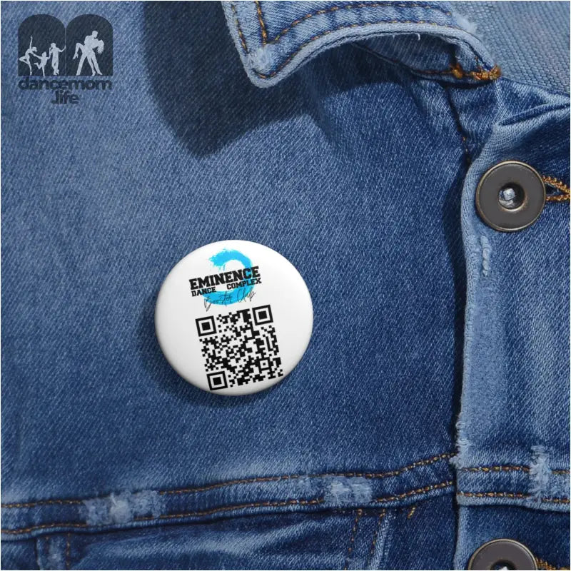 White circular button pin with a QR code and ’Experience’ text on it.