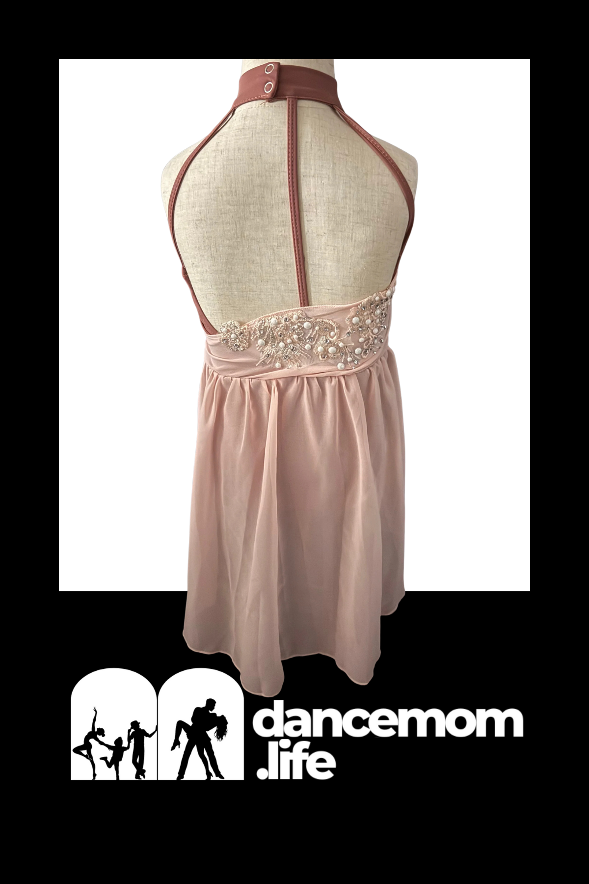 A blush pink halter-neck dance dress with a beaded waistband and matching straps.