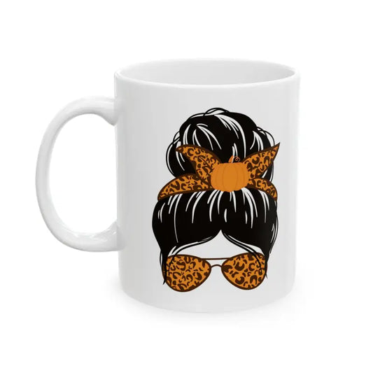 White coffee mug featuring a messy bun hairstyle design with leopard print bandana and sunglasses.