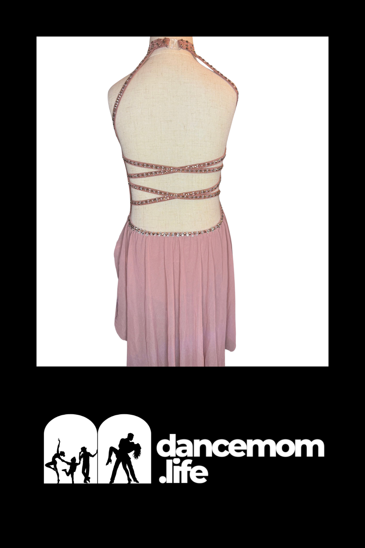 A blush pink halter-neck dance dress with a beaded back and flowing skirt.